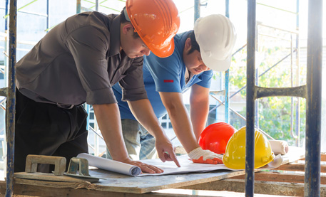 Men wearing hard hats at a construction site