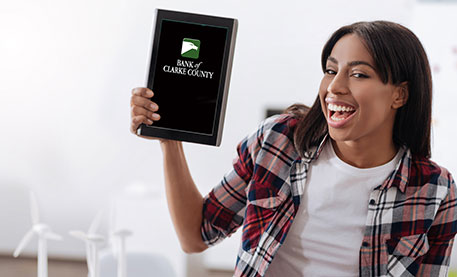 Smiling woman holding a tablet